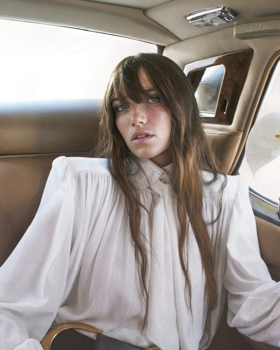 a fashionfocused scene set in a car interior featuring a subject styled elegantly