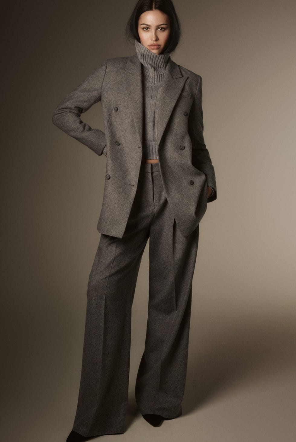 stylish outfit featuring a grey doublebreasted blazer and matching trousers