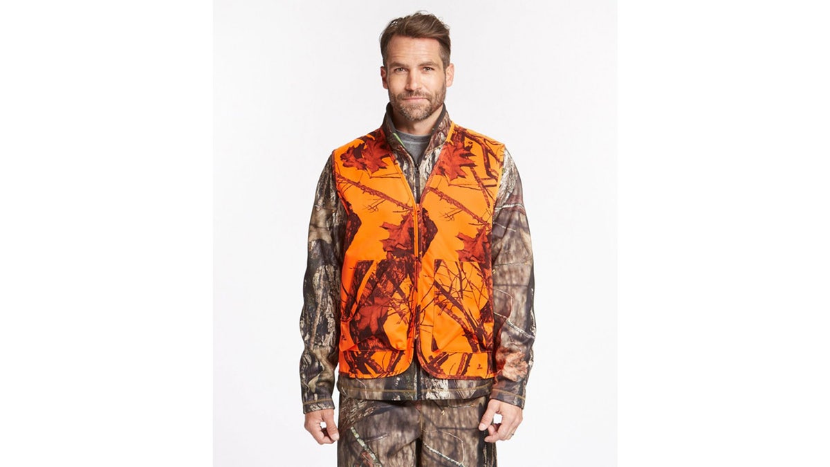 A lightweight orange vest with a camo pattern. 