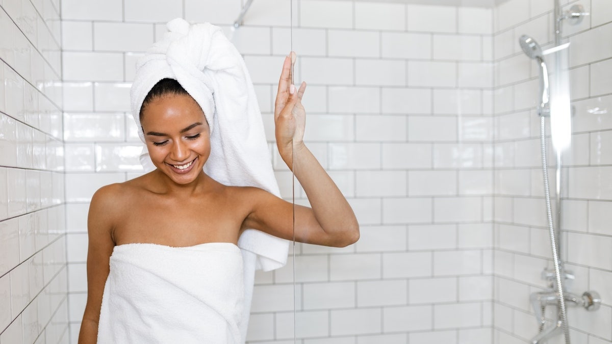 woman in white towel after showering