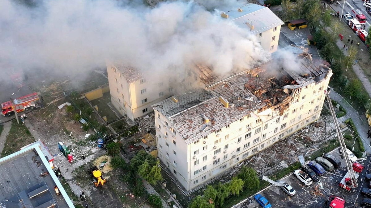 Smoke rises from damaged buildings, at the site of the Russian drone strike, amid Russia's attack on Ukraine, in Kharkiv, Ukraine in this handout picture released August 18, 2025. Press service of the State Emergency Service of Ukraine in Kharkiv region.