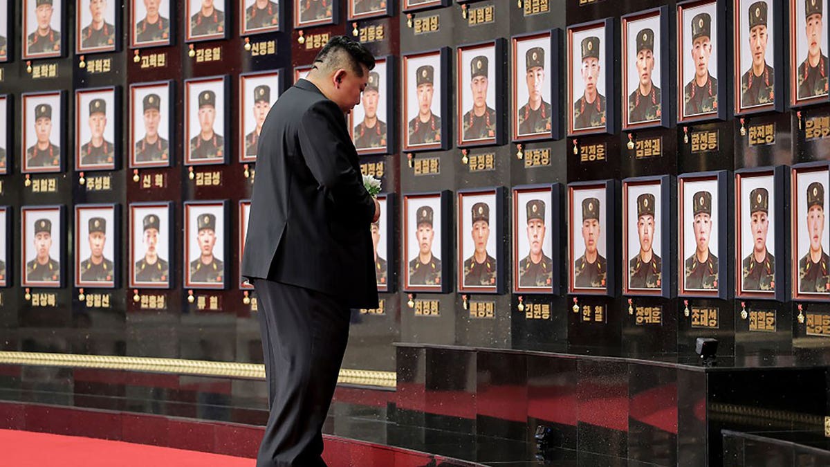 Kim Jong Un hugs soldier