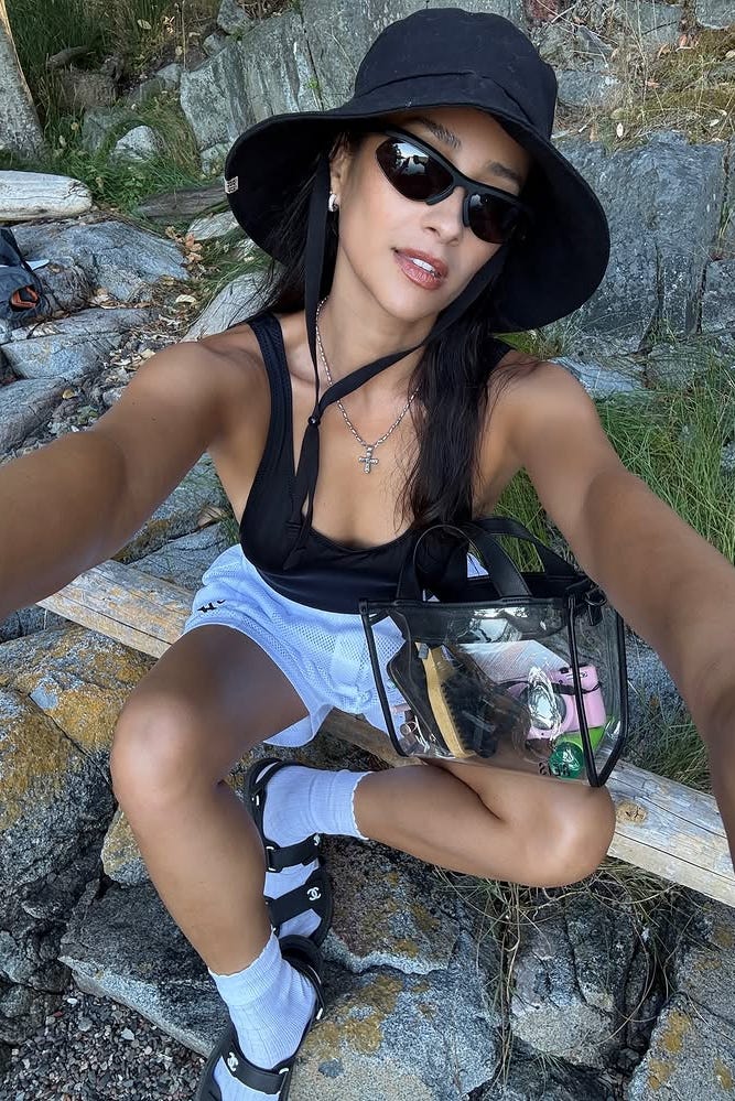 shay mitchell adventure outfit, athletic shorts, black top