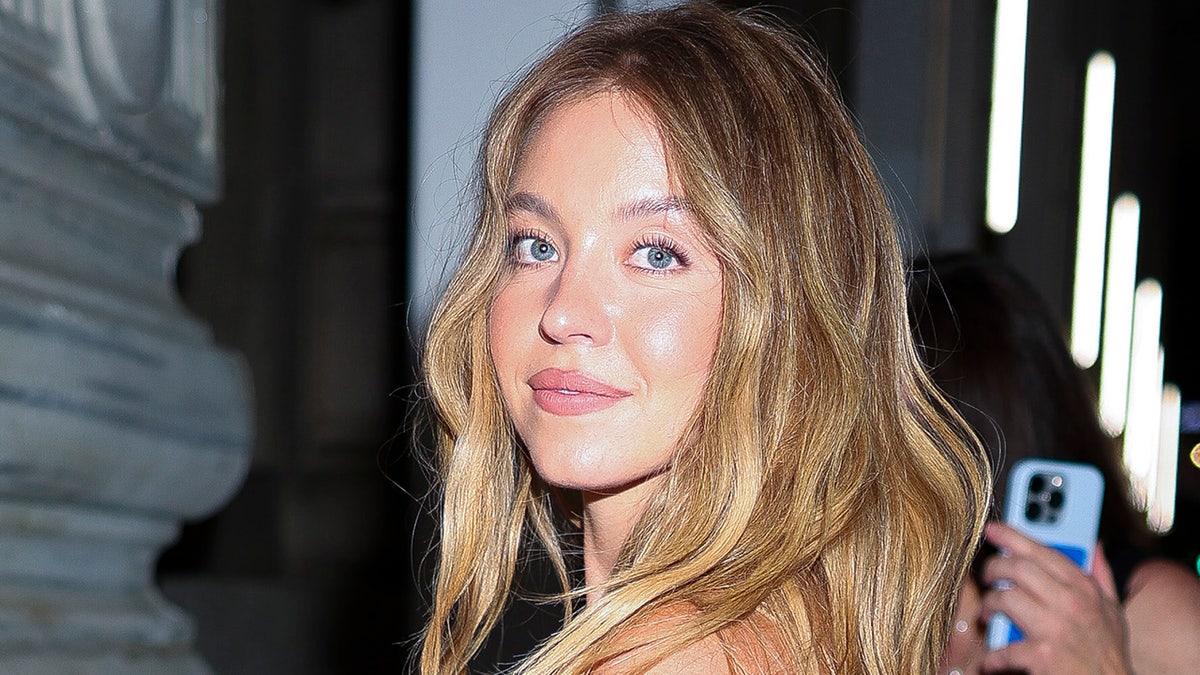 Sydney Sweeney smiling, hair down