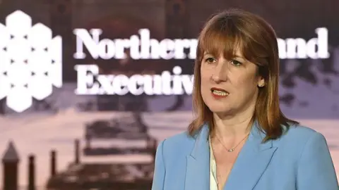 Getty Images Rachel Reeves wears a blue suit as she addresses a conference in Northern Ireland