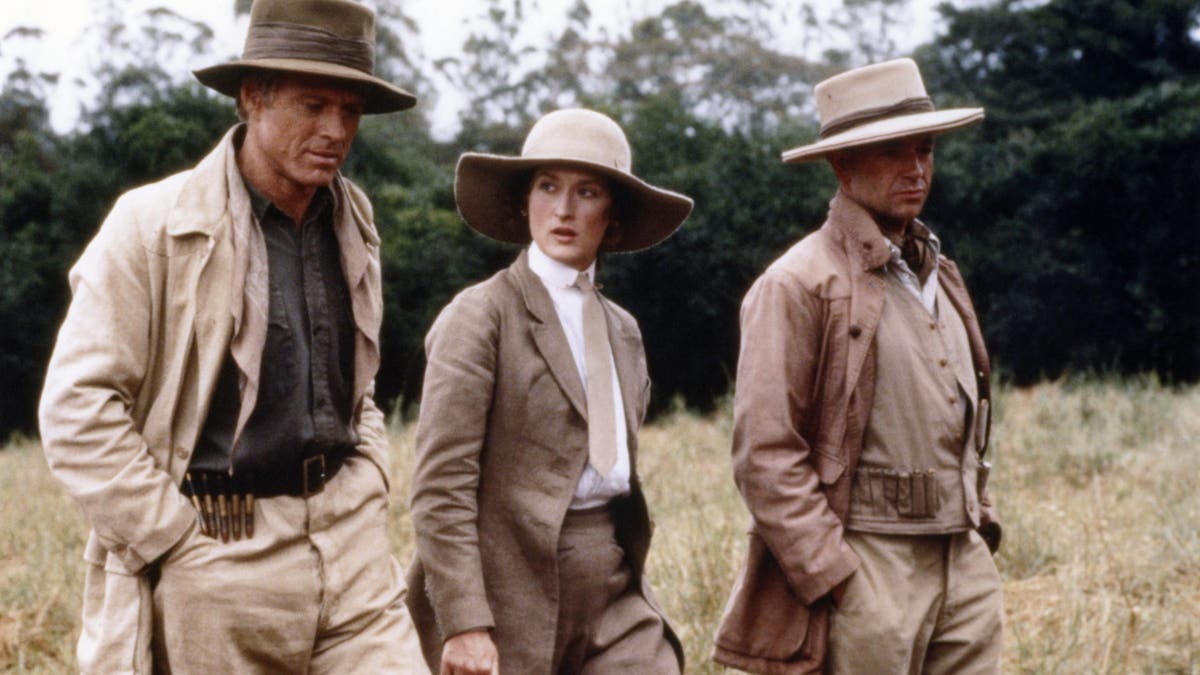 Robert Redford, Meryl Streep and Austrian actor klaus-Maria Brandauer on the set of out of africa