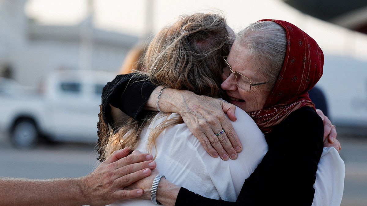 Barbie Reynolds hugging family