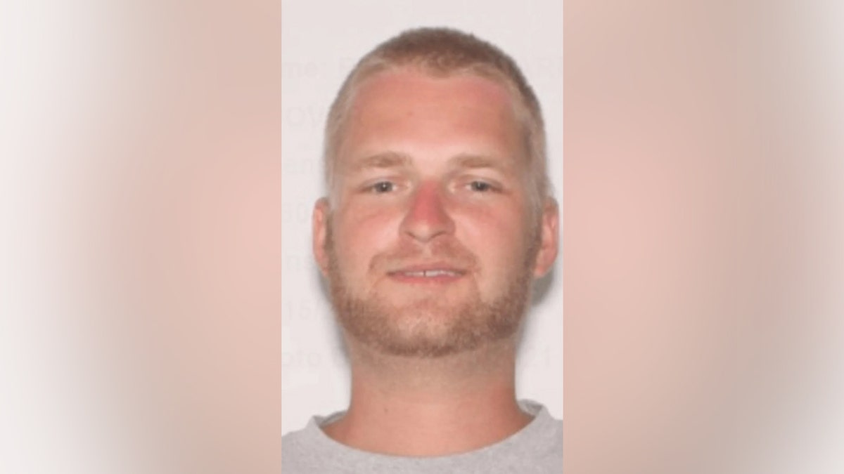 Blake Richard Hoover smiling in a mugshot