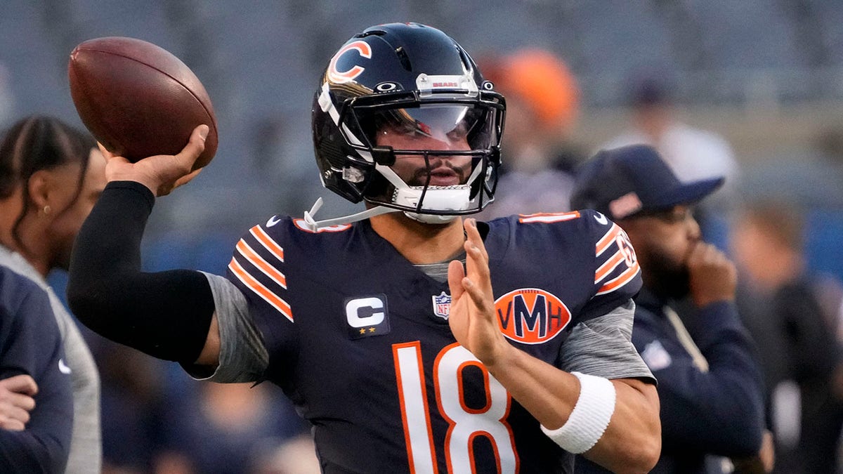 Caleb Williams throws football