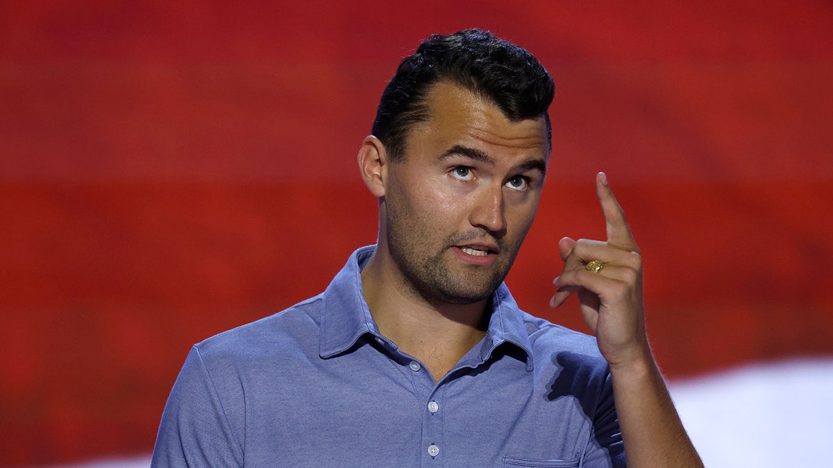 Charlie Kirk pointing up