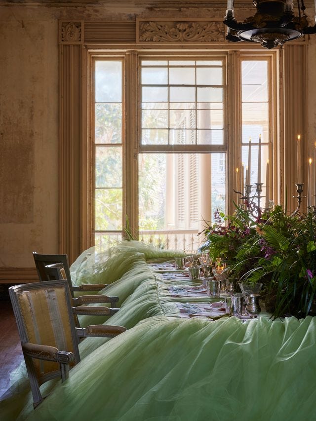 a decorated dining table set in a vintage room
