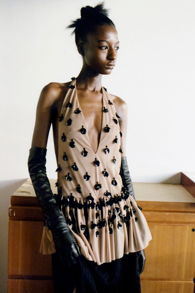 fashion model showcasing a unique dress design