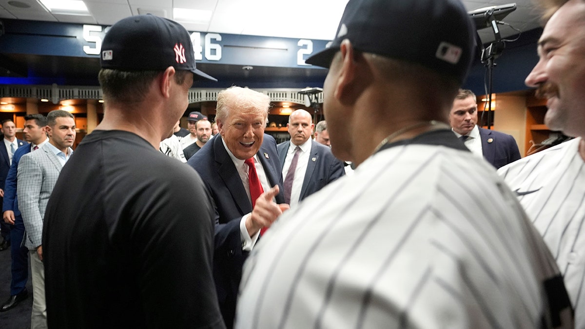 Donald Trump talks to Yankees players