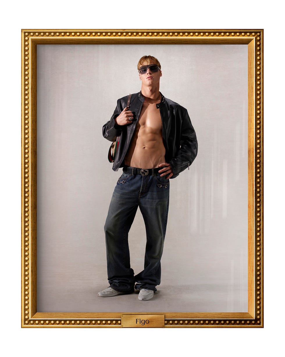 fullbody portrait of a man wearing a leather jacket and baggy jeans