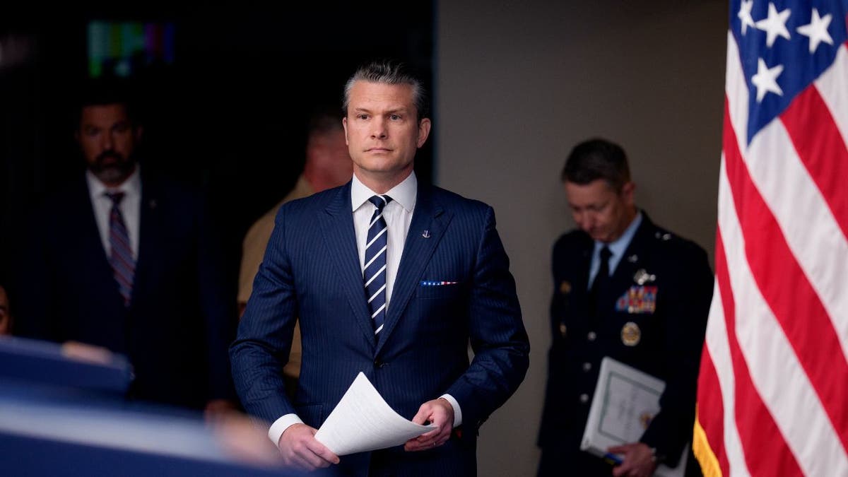 War Secretary Pete Hegseth arrives at a Pentagon briefing