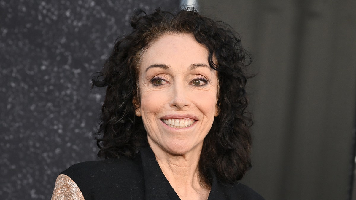 Heidi Fleiss smiles on the red carpet.