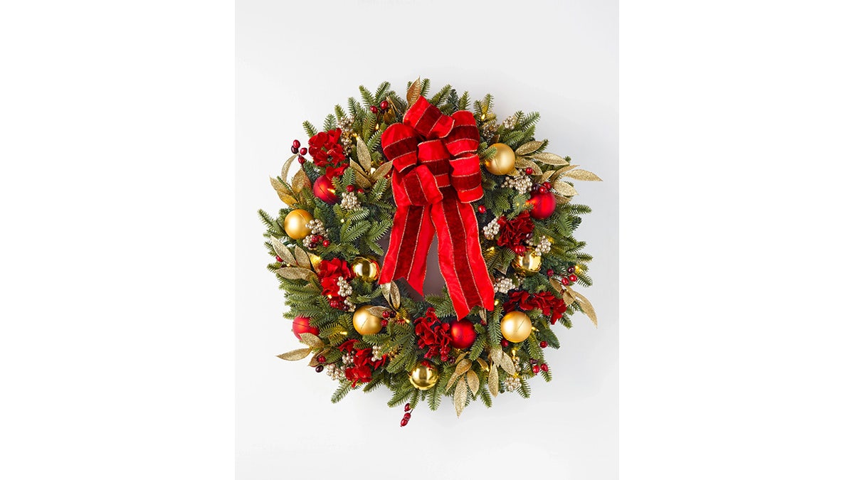 This wreath lights up with four AA batteries.