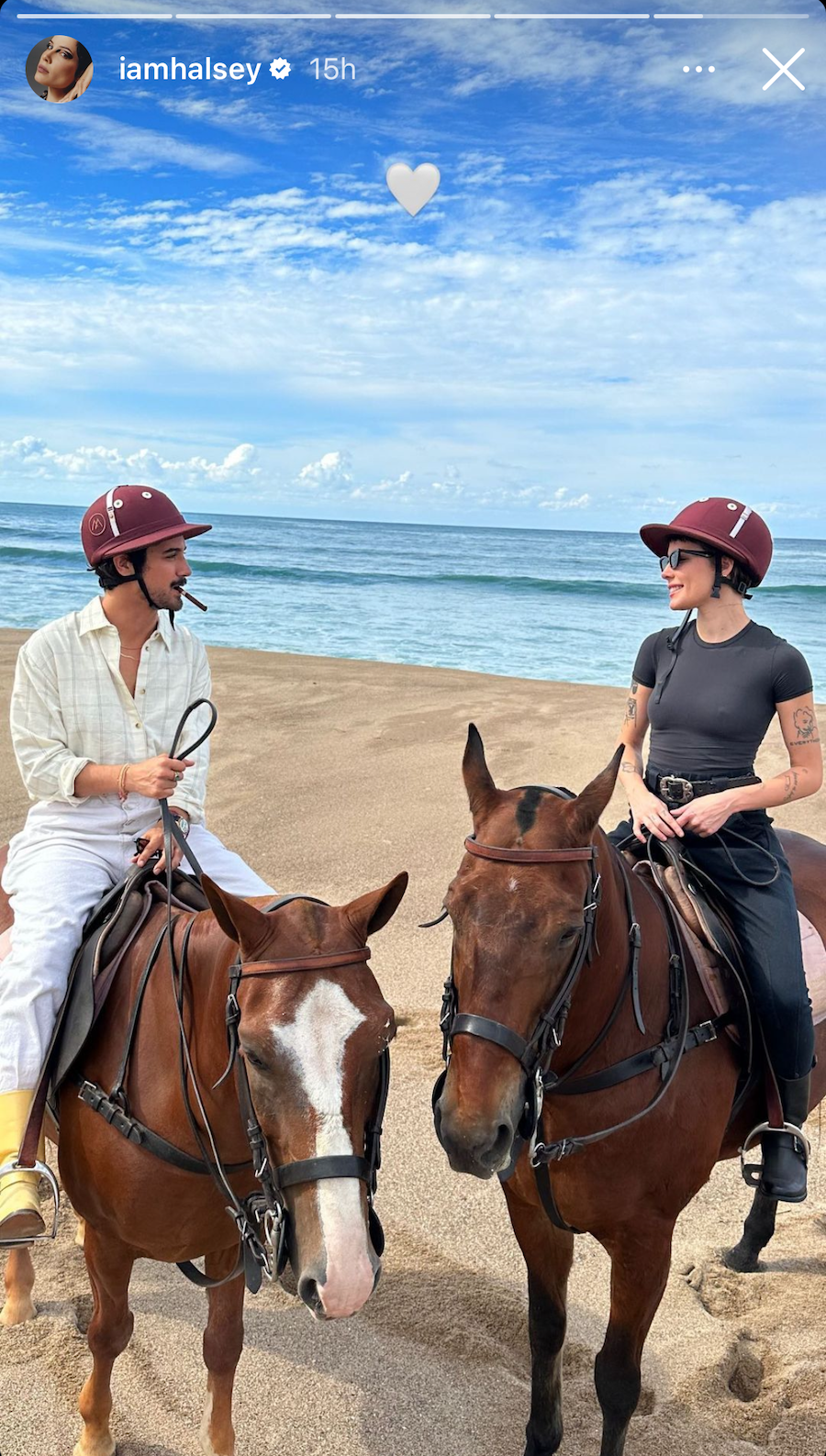 a man and woman riding horses