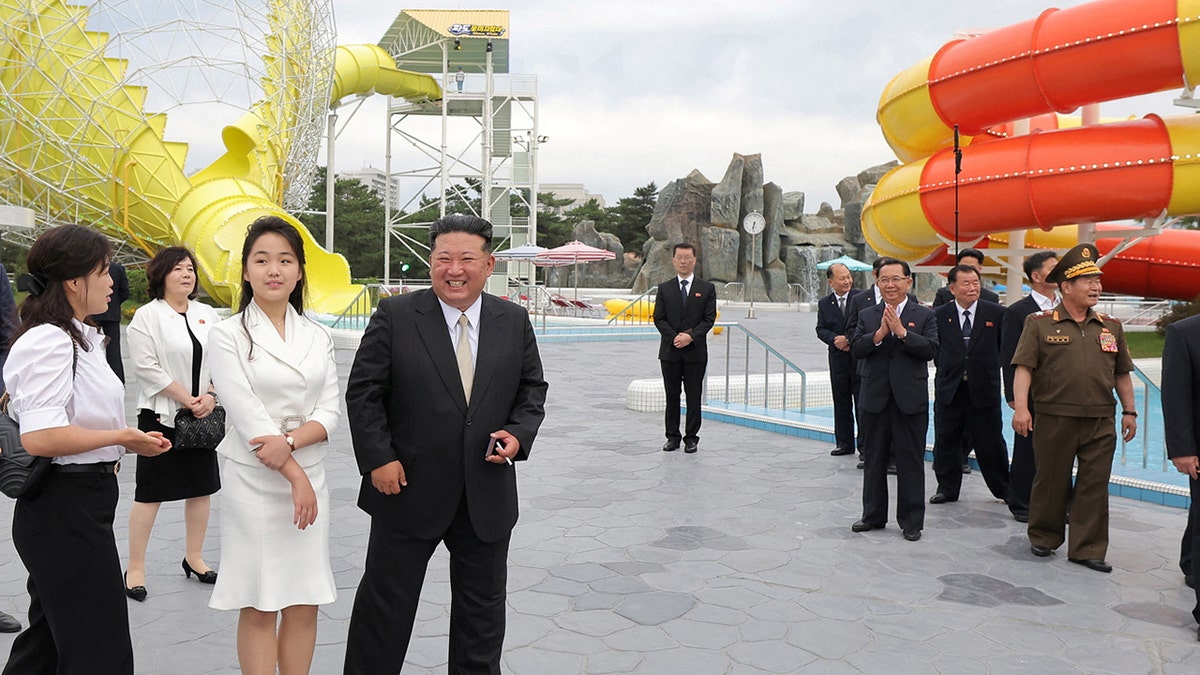Kim Jong Un, seen here with his daughter, Kim Ju Ae, has brought her to China for her first international trip.