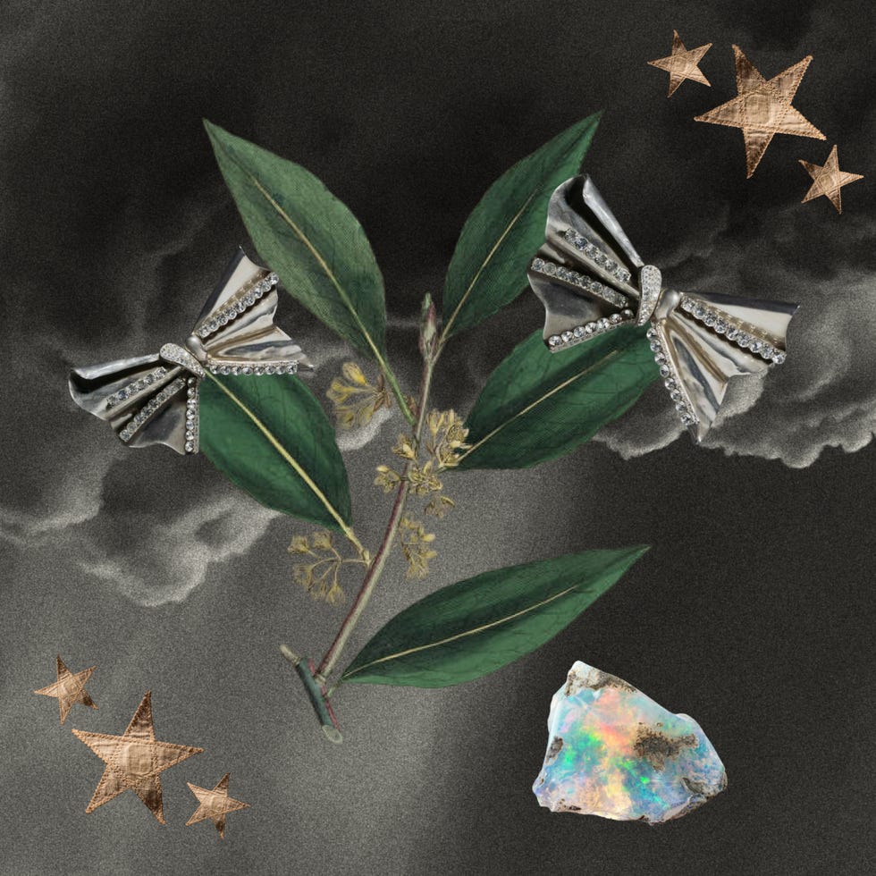 artistic composition featuring metallic butterfly decorations leaves stars and an opal