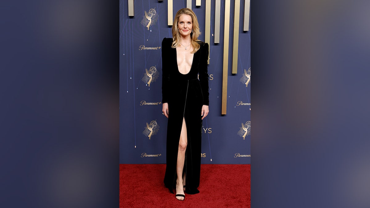 Meghann Fahy at the 2025 Emmy Awards in a black dress.