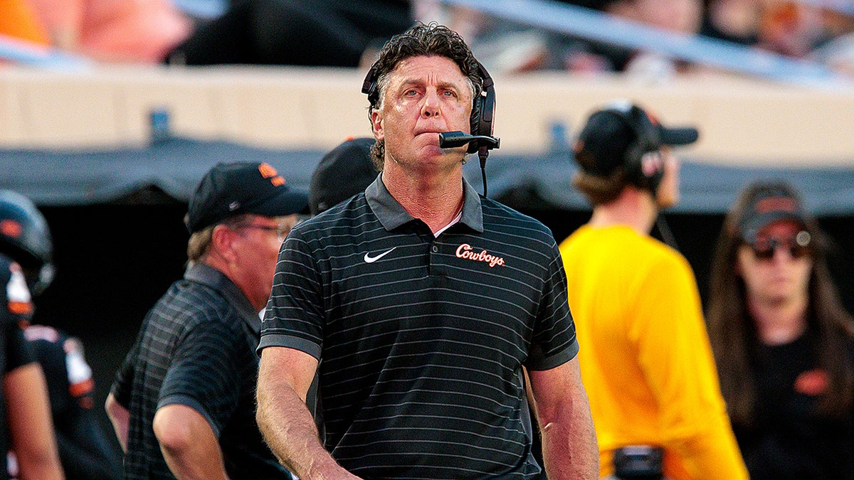 Mike Gundy looks on