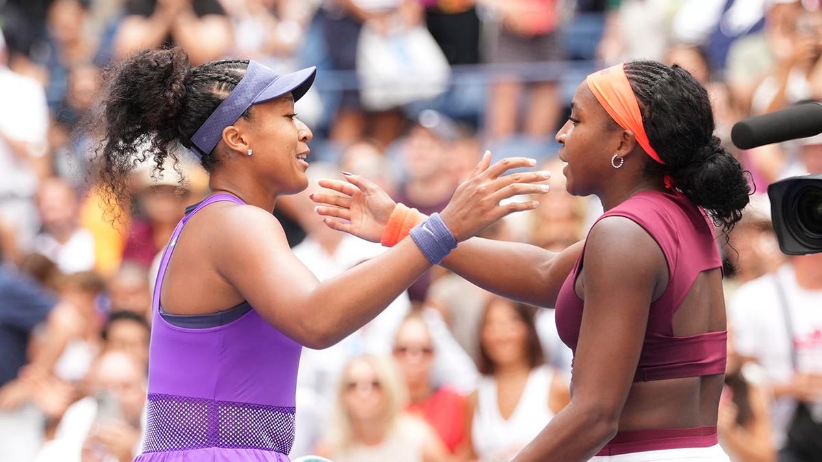 Naomi Osaka and Coco Gauff hug at net