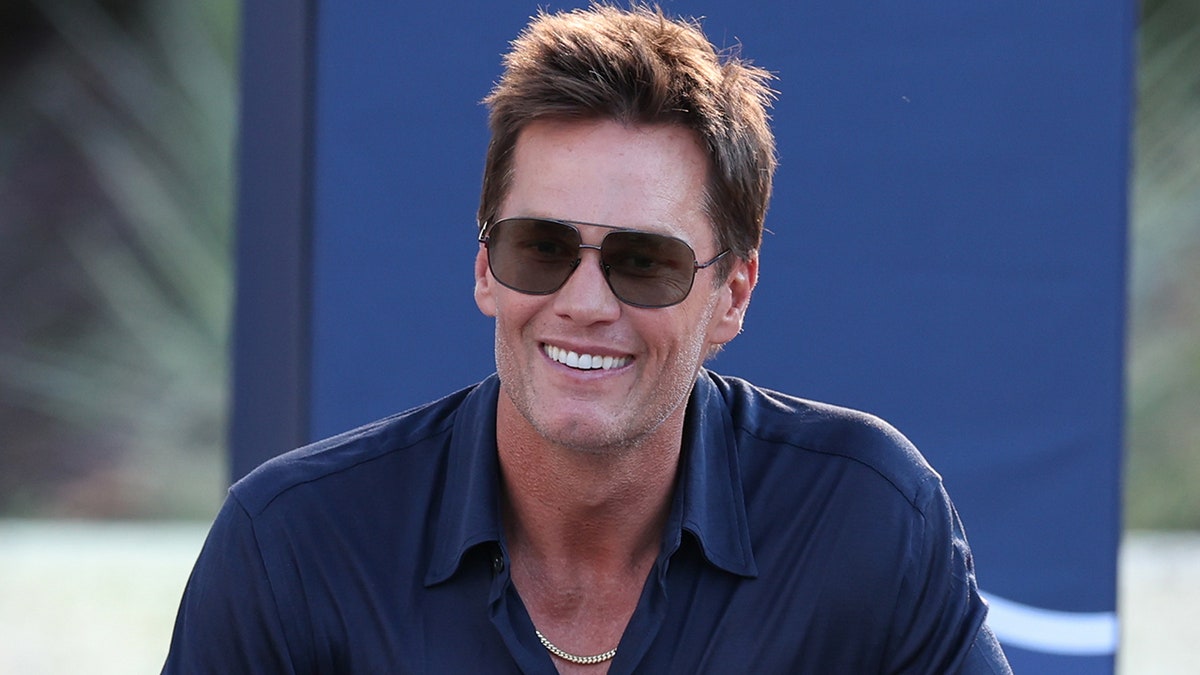 Tom Brady looks on