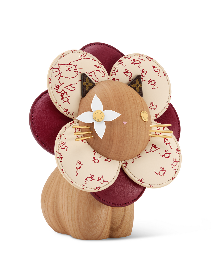 stylized floral sculpture with feline features
