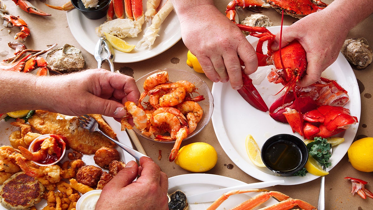 People eating seafood feast