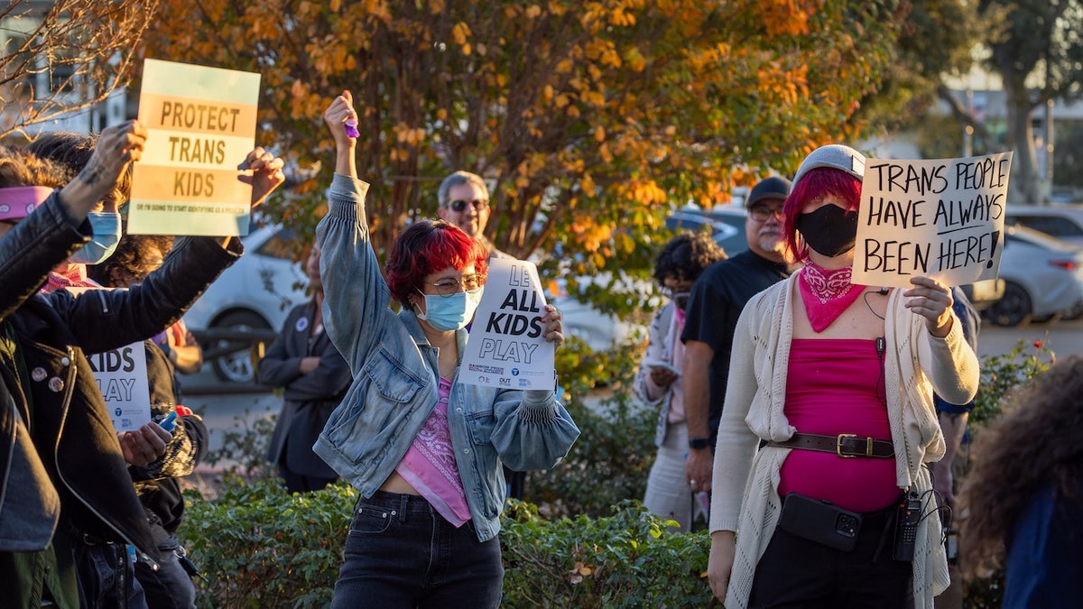protesters at transgender athlete school debate