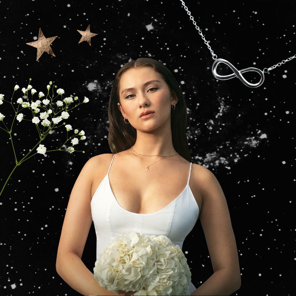 belly from the summer i turned pretty standing in front of a starry sky with her infinity necklace in the background