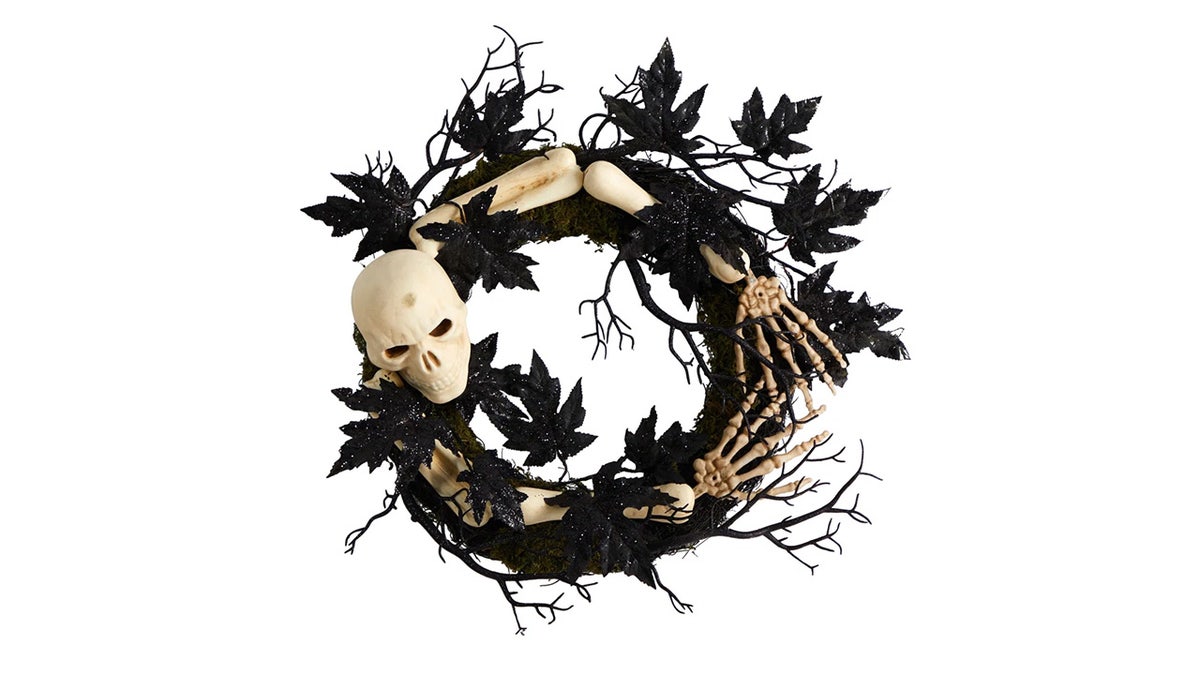 This 24-inch wreath showcases a spooky skeleton.
