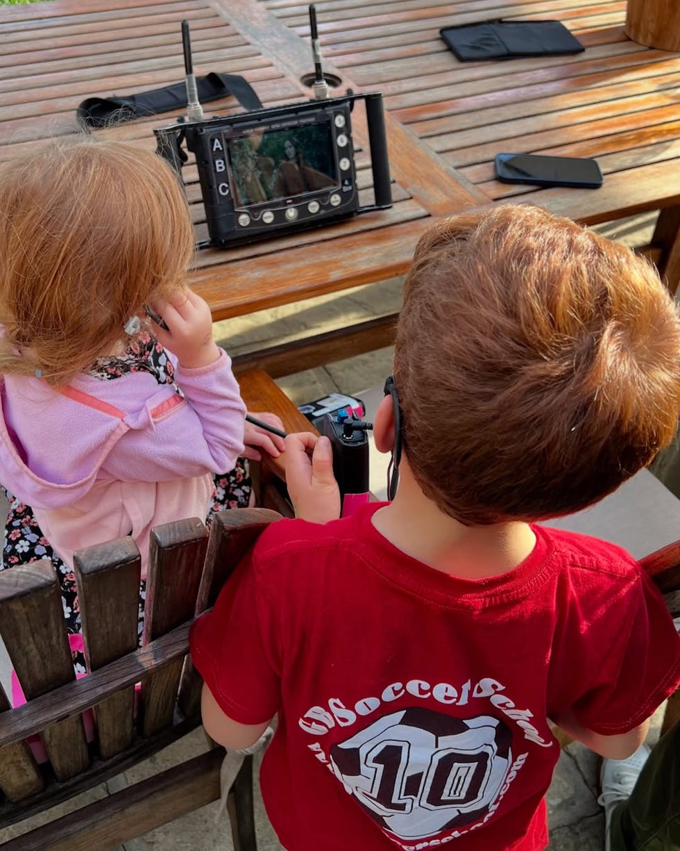 children observing a display screen related to a remotecontrolled device