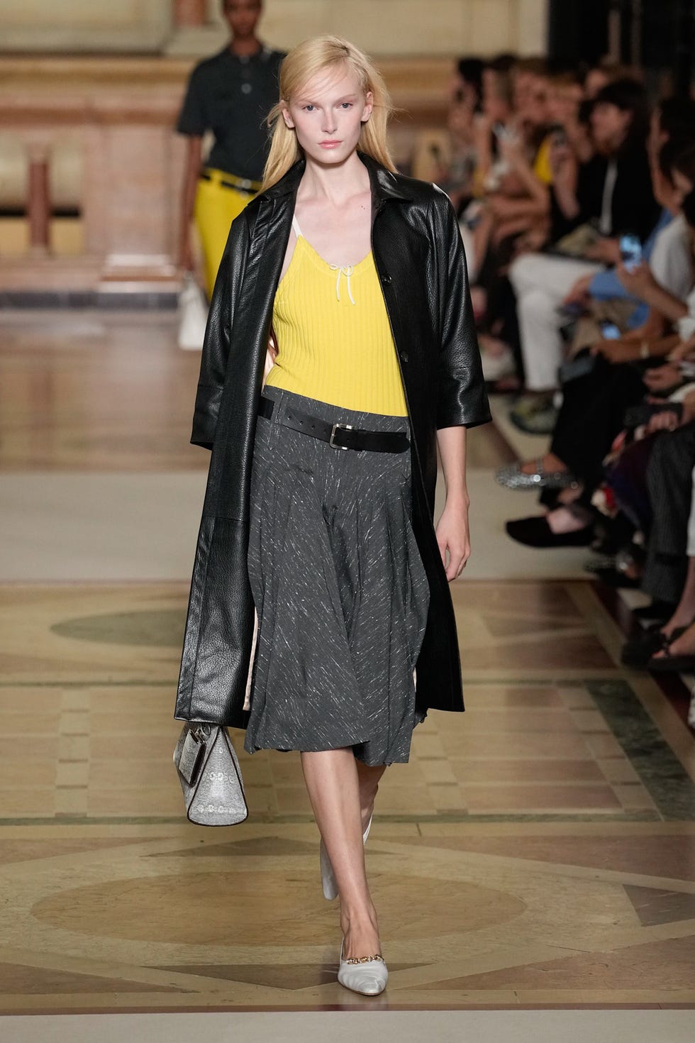 model showcasing a fashion outfit on a runway