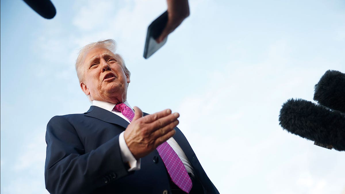 Trump speaks with the press