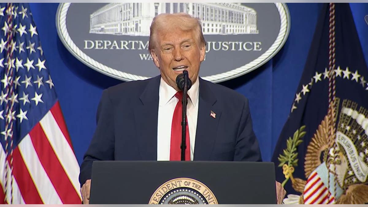 Donald Trump speaking at a podium