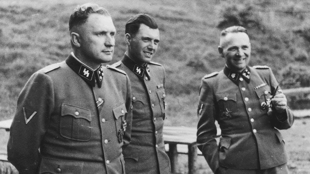 Josef Mengele (center) with fellow Nazis in 1944.