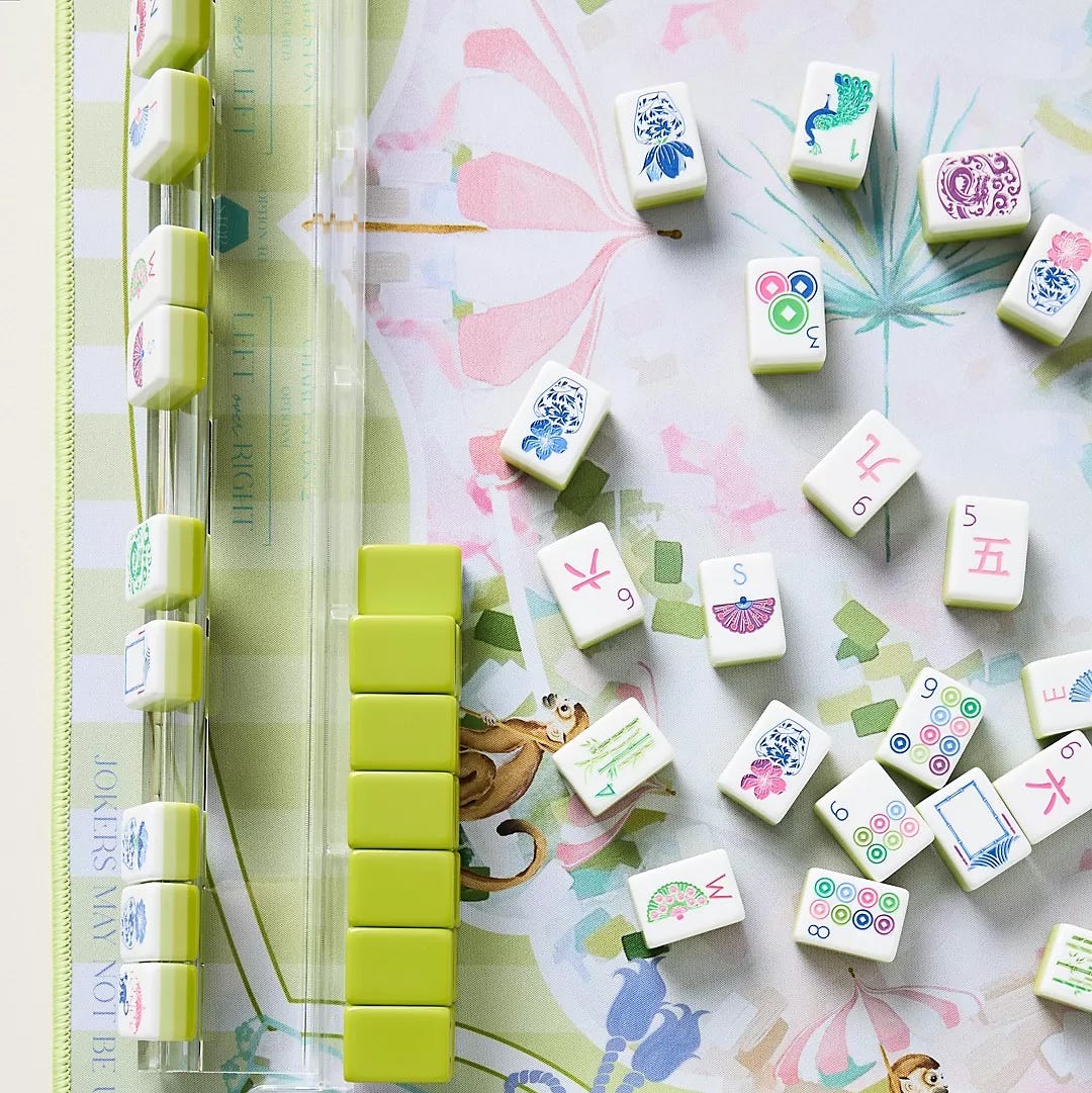 mahjong game set with tiles laid out on a colorful mat mahjong game set with tiles laid out on a colorful mat