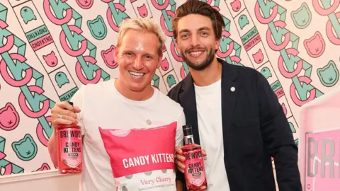 Getty Images Candy Kittens co-founders Jamie Laing and Edward Williams pose with the company's products