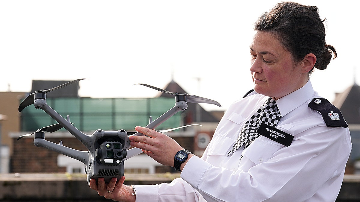 Police woman with drone