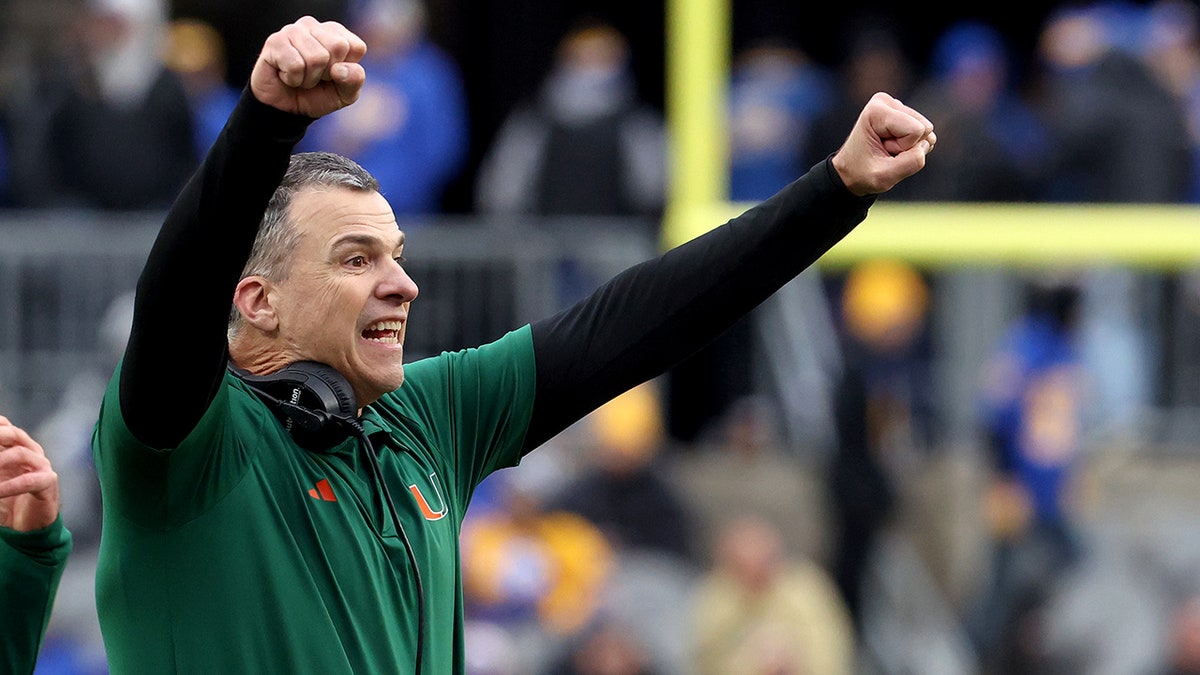 Mario Cristobal celebrates