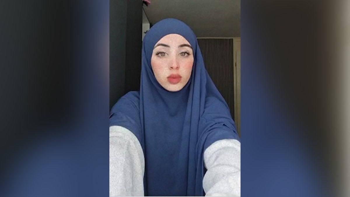 Ryan al Najjar in blue headscarf.