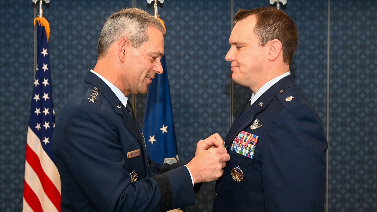 Air Force Chief of Staff Gen. Ken Wilsbach presents the Silver Star Medal to Lt. Col. William Parks.
